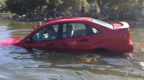 Caught on camera: Police rescue boy from submerged car